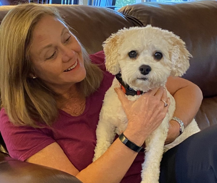 Ellen Adams, the secretary, with her dog Watson